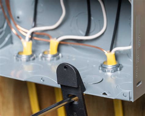 how to punch out metal outlet box|knock out electrical panels.